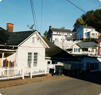 White homes ascending a hill