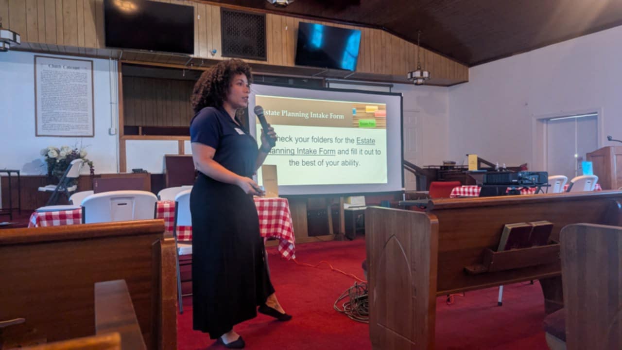 Jacy Fisher, Esq. presenting at an heirs' property clinic