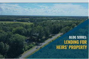 Aerial view of a rural landscape with fields and trees, with a blue diagonal overlay on the right reading 'BLOG SERIES: LENDING FOR HEIRS' PROPERTY'